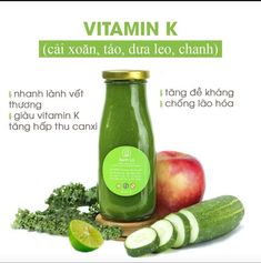 an advertisement for vitamin k with cucumbers, apples and green juice in it