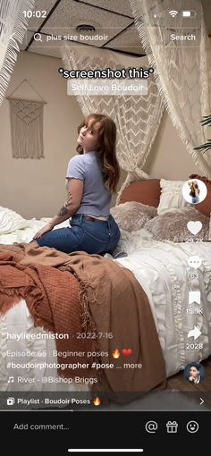 a woman sitting on top of a bed next to a white netted canopy over her head