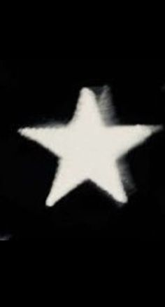 a black and white photo of a star