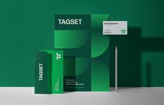 an assortment of tagset products on display against a green background with a sign that says taget