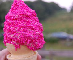 an ice cream cone covered in pink yarn