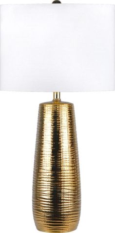 a gold table lamp with a white shade