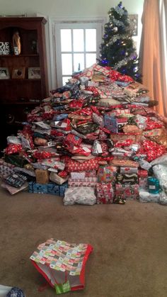 a christmas tree made out of wrapped presents