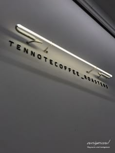 there is a sign on the wall that says tennoffe coffee - no matter