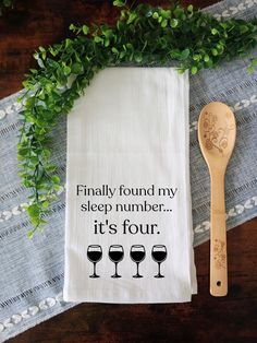 a tea towel with the words, finally found my sleep number it's four