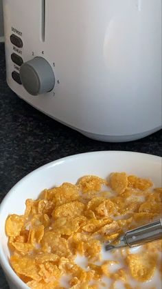 cereal in a bowl next to an air fryer