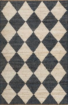 an area rug with black and white squares on it