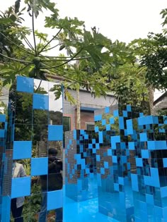 an artistic sculpture made out of blue squares