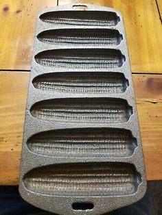 an old cast iron heat plate with holes in it