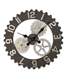 a clock made out of gears with numbers on it's face and the time in roman numerals