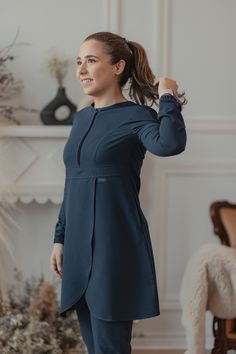 Whether you would like to refer to it as a knee length scrub top with a skirt-like bottom or a dainty scrub dress, we can assure you that Rose is the epitome of practicality like you’ve never seen it before. Inspired by our iconic bestselling Orchid top that you all know and love; Rose is designed with a flap on the torso for free, unrestricted, full range of movement and easy access to pant pockets. The top features a discreet, matching zipper at the top and two hidden pockets on the sides for Scrub Dress, Rose Scrub, Stylish Winter Coats, Scrub Suit, Scrubs Dress, Dental Life