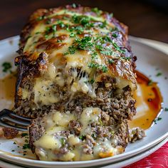 a piece of meatloaf on a plate with a fork