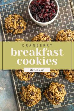 cranberry breakfast cookies on a cooling rack next to a bowl of cranberries