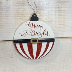 a merry and bright ornament hanging on a wall