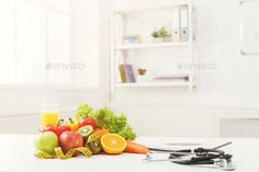 Nutritionist desk with fruit and stethoscope by Prostock-studio. Nutritionist desk with healthy fruit and stethoscope. Dietitian workplace. Weight loss and right nutrition concept, c...#stethoscope, #Prostock, #studio, #Nutritionist Nutrition Business Names, Nutrition Business, Food Photography Tutorial, Lifestyle Photoshoot, Healthy Fruit, Nutrition Education, Holistic Nutrition, Proper Nutrition