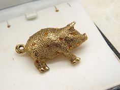 Hello and welcome to my shop. I am offering to you this lovely little fun pig vintage costume jewelry period  brooch. As you will see in the pictures the pig is made in a standing polished and patinated goldtone metal and set with sparkly rich orange eye and body stones. The brooch has a roll over pin fastener in good order.  The goldtone standing pig brooch is in an excellent used vintage condition with no or only very slight age related surface wear as shown. So please examine my five pictures Pig Costume, Pig Costumes, Jewelry Brooch, Vintage Costume Jewelry, Vintage Costumes, Costume Jewelry, Brooch Pin, Favorite Jewelry, Vintage Jewelry