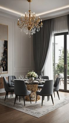 an elegant dining room with chandelier, chairs and table in front of sliding glass doors