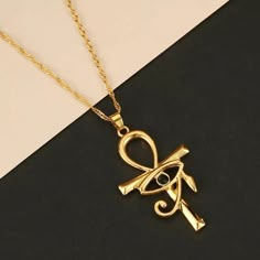 This Ancient Egypt Pendant, shaped as the revered Ankh Cross With the Eye Of Horus, is crafted from durable stainless steel. Symbolizing life and eternal protection, this pendant pays homage to ancient Egyptian culture in a sturdy and meaningful design. Chain Type: Link Chain Material: Zinc Alloy We ship worldwide to 185 countries! Please allow 1-2 business weeks for your order to arrive. Horus Eye, Photo Chain, Eye Of Horus Necklace, The Eye Of Horus, Egyptian Eye, Egyptian Necklace, Ankh Necklace, Ankh Cross, Dark Crystal