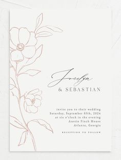 a wedding card with an orange flower on the front and bottom, in black ink