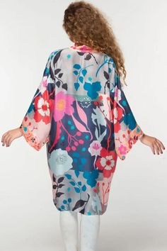 This elegant Malini kimono, by our friends at Sevya Handmade, is crafted with 100% Cupro material for a luxurious yet sustainable option. Its lightweight, breathable composition gives it a similar silk-like feel while significantly reducing care needs. Free-size designed with a floral pattern, this fair-trade garment will provide you with long-lasting comfort. Sevya, derived from Sanskrit, translates to "caring through service". Dedication to preserving India's unique arts and cultures is shown Silk V-neck Kimono For Daywear, Spring Satin V-neck Robe, Silk V-neck Summer Robe, Silk Wrap Kimono For Loungewear, Silk Wrap Kimono For Daywear, Spring Vacation Sleepwear With Kimono Sleeves, Spring Silk Wrap Robe, Bohemian Sleepwear With Kimono Sleeves For Spring, Summer Silk Lounge Robe