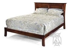 a wooden bed frame with two pillows on top of the headboard and foot board