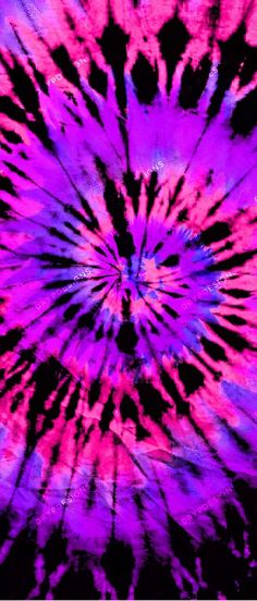 a purple and pink tie dye pattern with black spots in the center, on a dark background