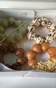 a box filled with different types of donuts