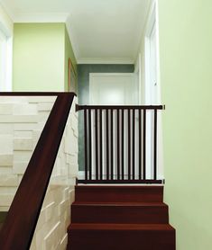 the stairs are made of wood and have handrails