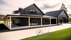 a large black house sitting on top of a lush green field