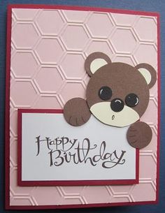 a handmade birthday card with a teddy bear holding a sign that says happy birthday