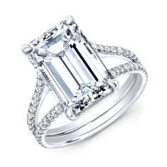 an emerald cut diamond ring with diamonds around it