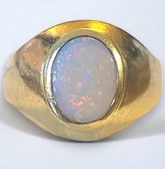 Beautiful Vintage 18k Yellow Gold Fiery Opal BOLD Signet Ring Size 6.75! A gorgeous ring, crafted beautifully in solid 18k yellow gold! Size 6.75 Opal measures approximately 9mm x 7mm Bezel set oval opal In nice vintage original condition. Weight: 5.1 grams Shipped FAST and FREE, in a gift box, and fully insured! Formal Gold Cabochon Signet Ring, Gold Dome Cabochon Ring In 14k Gold, Gold 14k Opal Ring As Gift, 14k Gold Opal Ring For Gift, Heirloom Gold Opal Ring With Cabochon, Heirloom Gold Opal Cabochon Ring, 14k Yellow Gold Dome Ring, Heirloom Gold Opal Ring With Polished Finish, Classic Gold Opal Gemstone Ring