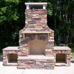 an outdoor fireplace made out of bricks and stone