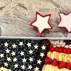 an american flag tray with cheese, fruit and crackers