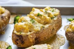 baked potatoes with macaroni and cheese on them