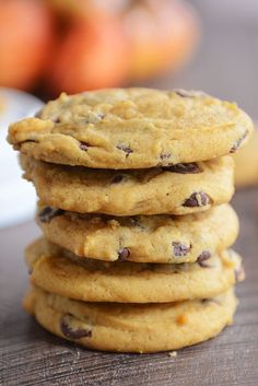 a stack of cookies sitting on top of a wooden table