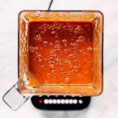 a jar filled with liquid sitting on top of a table