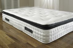 an image of a mattress that is on the floor in the room with wood floors