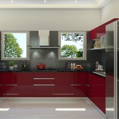 a modern kitchen with red cabinets and stainless steel appliances