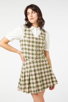 green Preppy Fitted V-neck Top, Fitted Plaid Sleeveless Vest, Preppy Fitted Plaid Top, Fitted Sleeveless Plaid Vest, Green Preppy Top For Workwear, Preppy Green Top For Work, Fitted Gingham V-neck Top, Fitted Plaid Cotton Vest, Green Fitted Tops For School