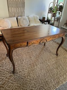 a coffee table sitting on top of a carpeted floor