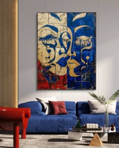 a living room with blue couches and paintings on the wall