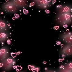 many pink hearts floating in the air with sparkles and stars around them on a black background