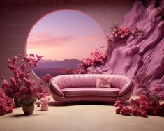 a pink couch sitting in front of a large window with flowers on the ground and mountains behind it