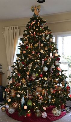 a decorated christmas tree in a living room