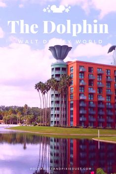 the dolphin hotel in walt disney world with palm trees and blue sky reflected in water