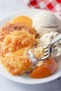 a white plate topped with fruit and ice cream