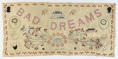 a piece of cloth with the words bad dreams written in pink and red on it