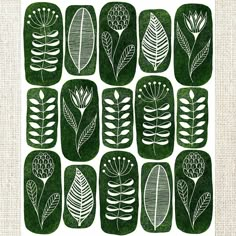 a green and white print with leaves on it