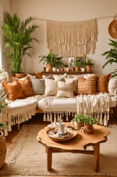 a living room filled with lots of furniture and potted plants on top of it